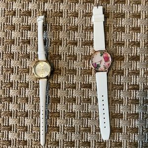 2 watches with white bands